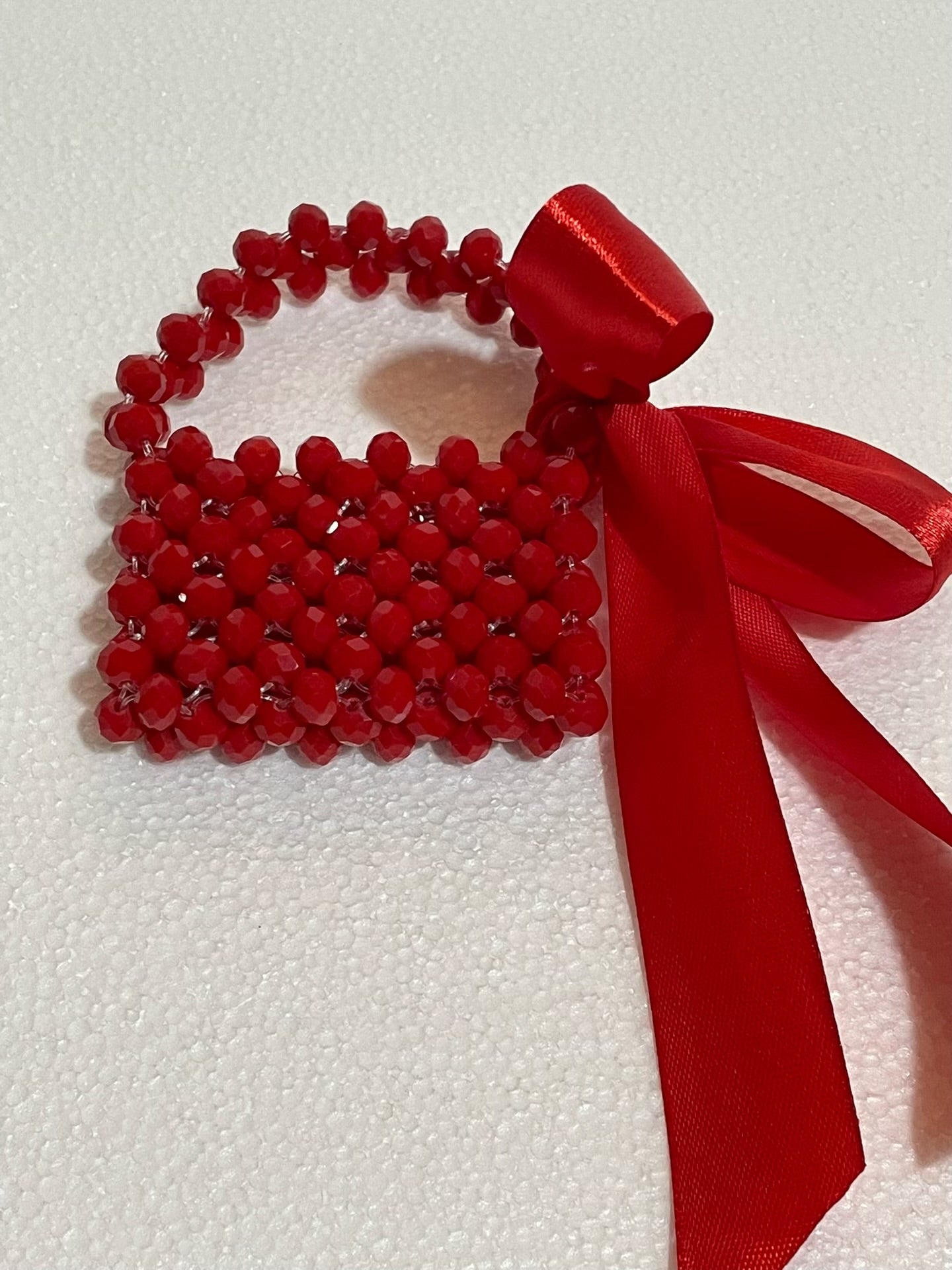 Handmade crimson crystal bag charm with satin ribbon bow – Bassmera