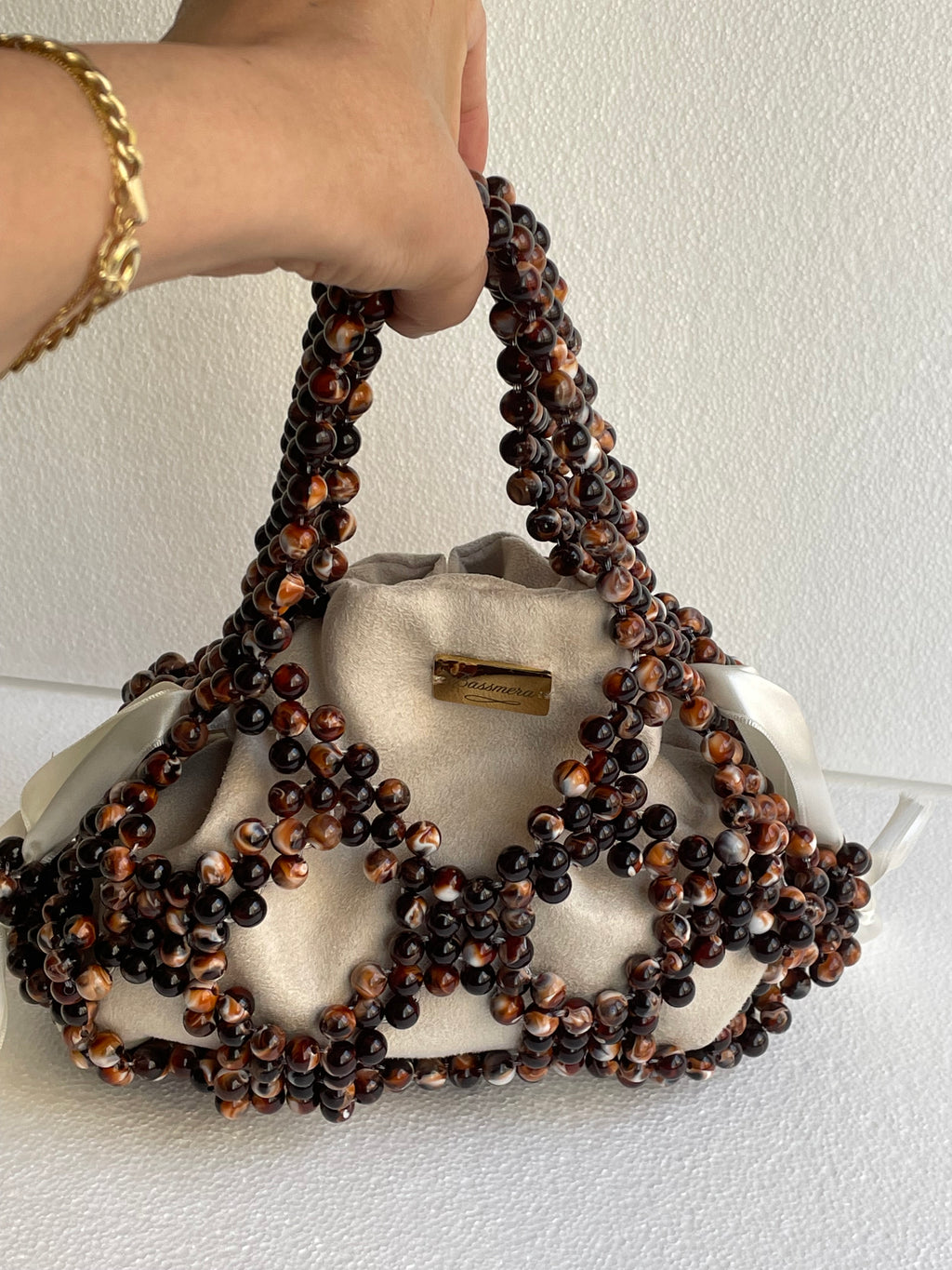 Bassmera Noisette beaded handbag front view – satin ribbon closure and beaded handles